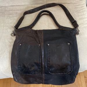 Free People Leather tote with shoulder and crossbody strap.